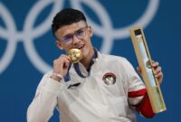 Lifter kebanggaan Indonesia, Rizki Juniansyah mempersembahkan medali emas kedua buat Tim Indonesia di Olimpiade Paris 2024. (Foto:NOC Indonesia)