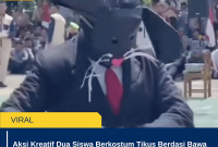 Aksi Kreatif Dua Siswa Berkostum Tikus Berdasi Bawa 