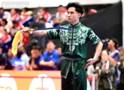 Atlet wushu Seraf Naro Siregar beraksi di arena pertandingan Asian Games 2026.
