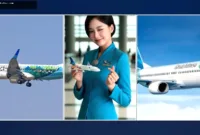 Garuda Indonesia batalkan — Pesawat Garuda Indonesia terparkir di landasan pacu bandara saat cuaca berawan