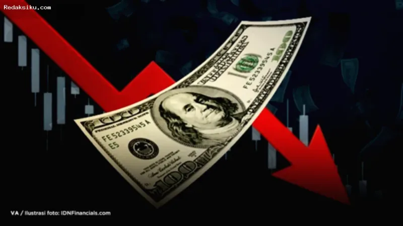 Grafik pergerakan nilai tukar Dolar Kanada yang melemah terhadap Dolar AS di layar monitor perdagangan.