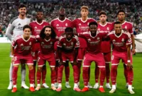 Jadwal Liga Champions 2026/27 — Trofi Liga Champions dengan latar belakang stadion sepak bola yang megah