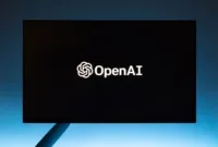 Ilustrasi logo OpenAI dan Anthropic yang mewakili negosiasi uji coba keamanan sistem AI